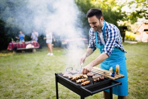 Man barbequing outdoors