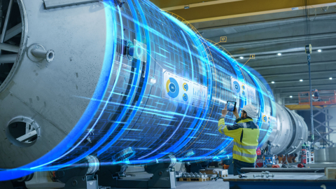 A photo of a person working on a digital display in a warehouse.