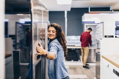 Couple shopping for a refrigerator