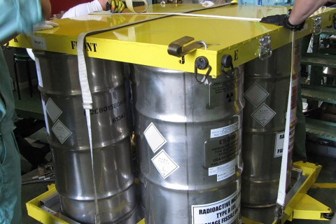 Kyoto University and Y-12 National Security Complex technical experts prepare the highly enriched uranium shipping containers for transportation