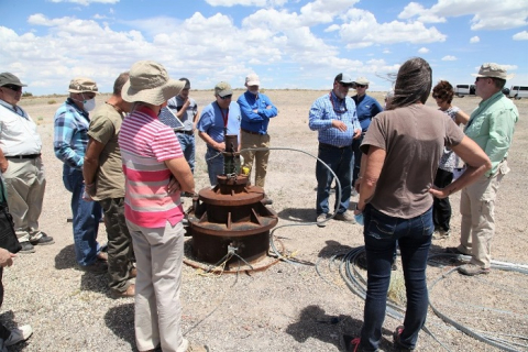 Peer reviewers observe a well at the Pahute Mesa groundwater area at the Nevada National Security Site. 