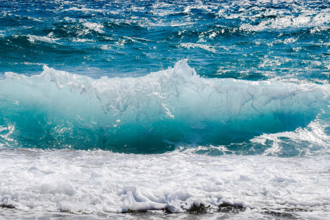 Waves crashing on the beach.