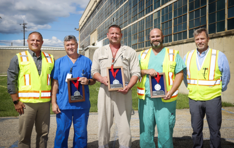 Fluor-BWXT Portsmouth (FBP) Site Project Director Greg Wilkett and Site Project Deputy Director James Miller, thank FBP maintenance mechanics and Maintenance Supervisor for their role in saving the life of a co-worker at the Portsmouth Site. The three team members received the Silver Medallion Medal of Safety Award, one of Fluor’s highest awards.