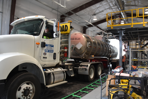 A tanker unloads at a backup load-in station at the Effluent Treatment Facility on the Hanford Site. Driver Nick Bass delivers 6,200 gallons of leachate collected from a mixed-waste burial trench.