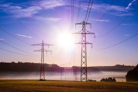 Power lines with sun shining
