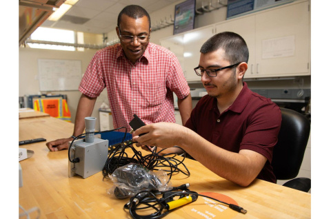 Isidro Garcia and his STEM mentor, PNNL physicist Cheslan Simpson working with electrical cables