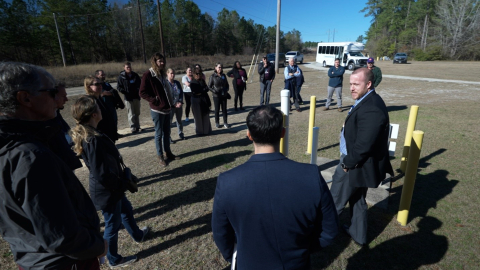 Tom Danielson, right, a scientist in the Environmental Science and Dosimetry Division of the Environmental Management Directorate at Savannah River National Laboratory, leads a field discussion about the groundwater sensor network installed at Savannah River Site’s F Area as part of the Advanced Long-Term Environmental Monitoring System project. (Image by Brad Bohr)
