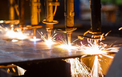 a laser cutter cutting metal