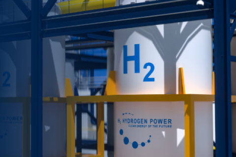 Rendering of a large white hydrogen storage tank with H2 displayed on it