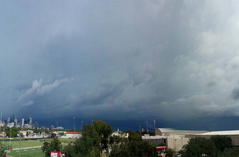 Photo of the skyline of Houston, Texas with dark clouds above it