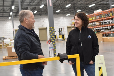 Late Project Director and Bechtel Senior Vice President Valerie McCain, right, spoke with Andy Doles, Waste Treatment Completion Company engineering specialist, last year during a celebration luncheon.