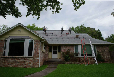 Installing solar panels on a homeowner's roof