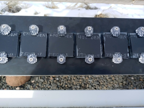 Photo of a row of test solar cells in an outdoor testing setup