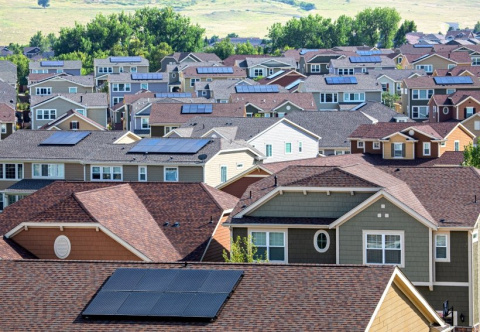 houses with solar panels on roofs