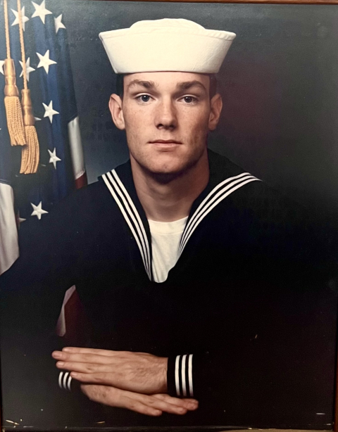 A man in a Navy uniform