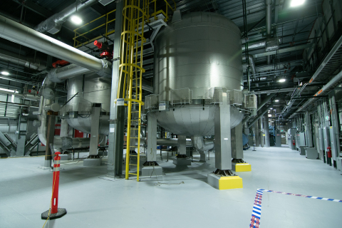 A large room with lots of metal vessels and machines