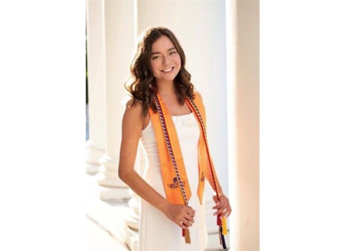 Photo of Polly Keim wearing graduation sash