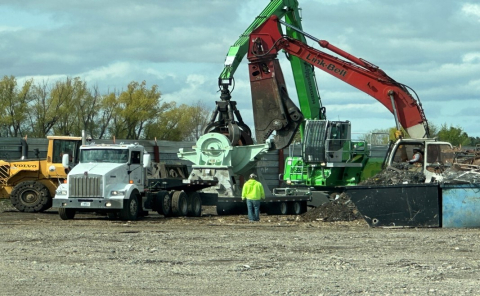 Trucks and large equipment machines at a work site