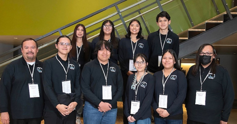 A team photo of Los Alamos employees and high school students