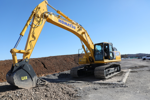 A large yellow hybrid excavator 