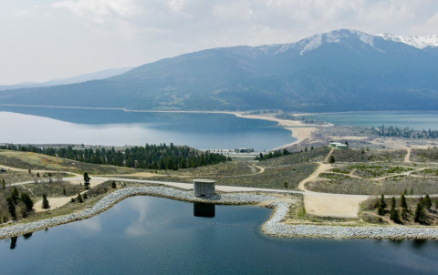 A pumped storage hydropower facility, with mountains in the distance