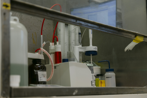 A fume hood with materials inside and around it