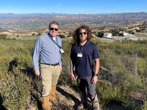 Two men standing in front of an overlook of theEnergy Technology Engineering Center’s (ETEC) portion of the Santa Susana Field Laboratory 