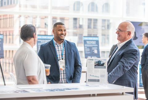 People having a conversation at a conference.