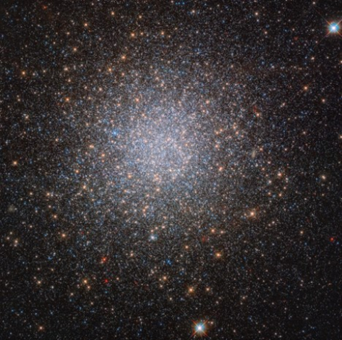 Hubble Space Telescope image of the globular cluster NGC 2419, a collection of stars orbiting the Milky Way about 300,000 light years away from Earth.
