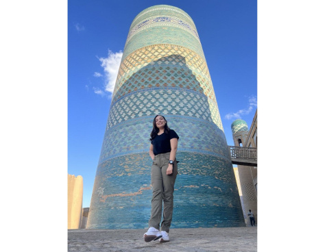 Maricarmen Corte standing in front of a large round blue tiled structure.