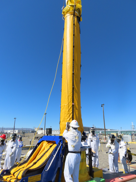 Hanford worker with tall yellow pump
