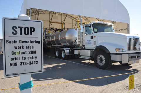 A tanker truck is filled with wastewater from the K West Reactor spent-fuel storage basin. 