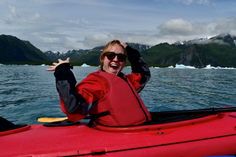 Tayor Asher, SCEP employee, kayaking by Bear glacier.