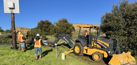 U.S. Department of Energy contractors provide oversight of trenching activities.