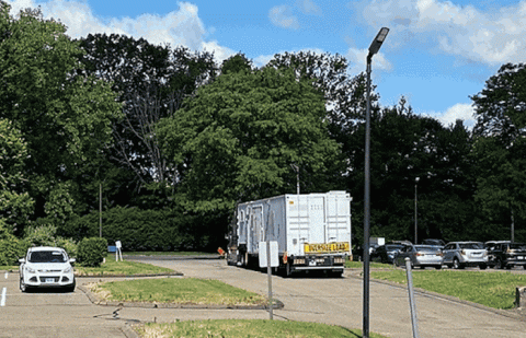 Rotating images of materials being shipped and the trucks carrying the materials.