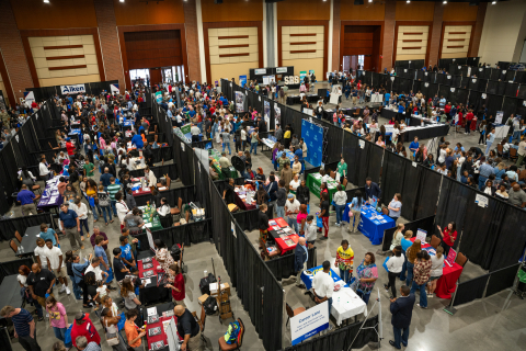 An aerial view of a large career fair filled with people
