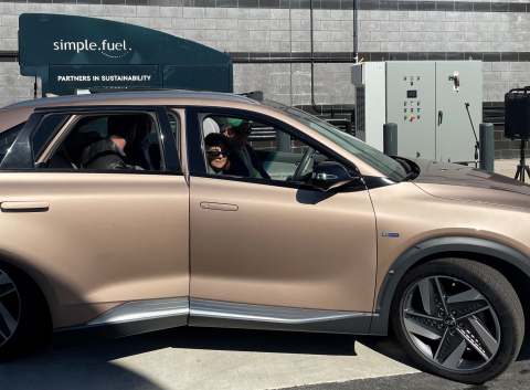 Fuel cell vehicle at a station outside of a stadium