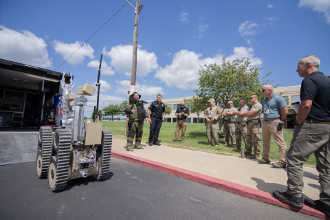 Paducah Police Department Community Engagement Officer conducts a briefing on the capabilities of the department’s bomb squad robot. 