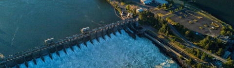 Aerial view of hydropower dam releasing water 