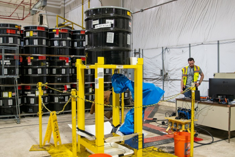 An Integrity Assessment Group employee supervises an evaluation of ultrasonic testing technology.