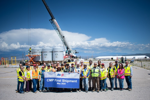 EM-LA & contractor leadership and waste operations crew pose for the first corrugated metal pipe transuranic waste stream shipment at Los Alamos National Laboratory