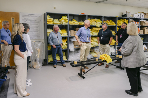 Employees standing inside a training room