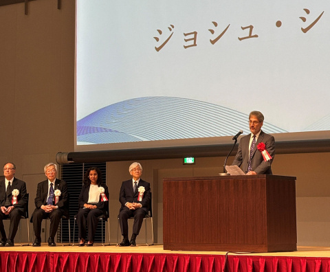 Dr. Josh Silverman delivers a message supporting the Radiation Effects Research Foundation at the Commemorative Ceremony of its 50th Anniversary in Nagasaki. Photo Credit: Cato M Milder 2025