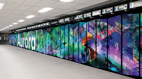 An image of the Aurora supercomputer cabinet, which has its name on it and a variety of abstract scientific symbols and patterns