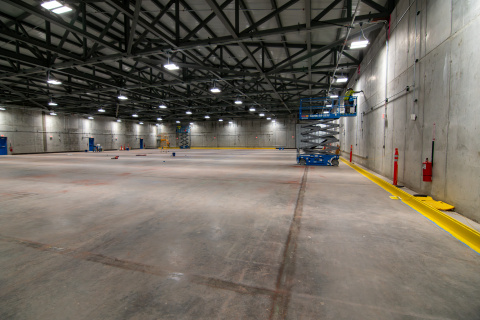 The inside of a large empty storage building