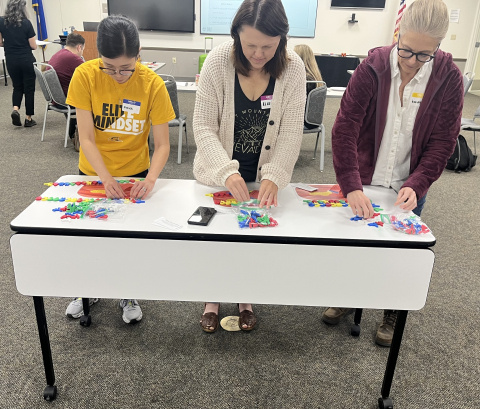 Three women participating in an educational training