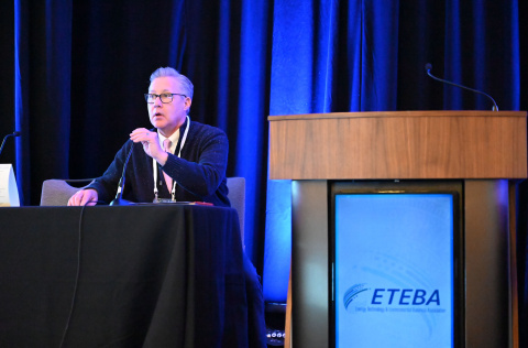 The PPPO and Oak Ridge field manager Erik Olds sitting at a panel table on a stage