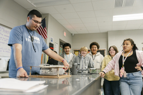 A group of students participating in a STEM experiment in a lab