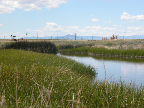 Producing wells and irrigation pond in the Elk Basin of Wyoming