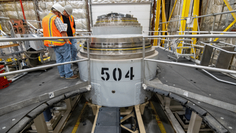Rotating set of images of waste containers being prepared for shipment at the Idaho Site